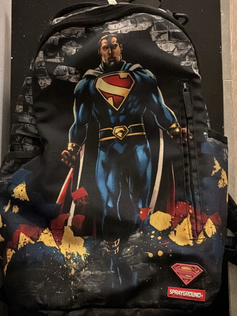 Sprayground Black Backpack with Superman Graphic and Blue, Red, Gold Accents